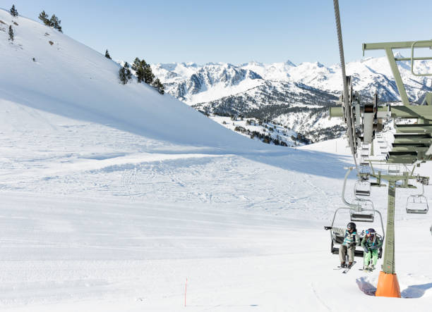 istock Man and woman on ski lift 660685356