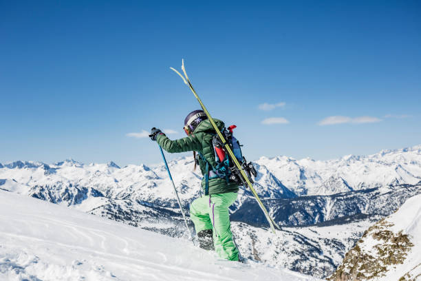 istock Female backcountry skier ascending mountain 660685366