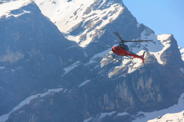 istock Red helicopter and Himalaya Annapurna mountain, Nepal 660690510