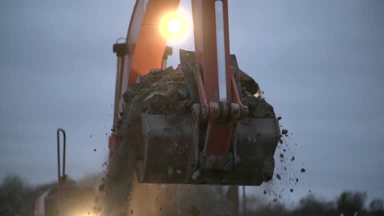 Excavator Transports the Ground at Night