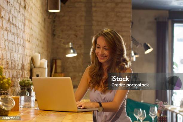 Young Woman With Computer Stock Photo - Download Image Now - 2017, Adult, Adults Only