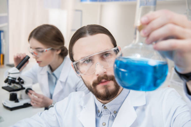 istock Scientist holding chemical reagent 660701050