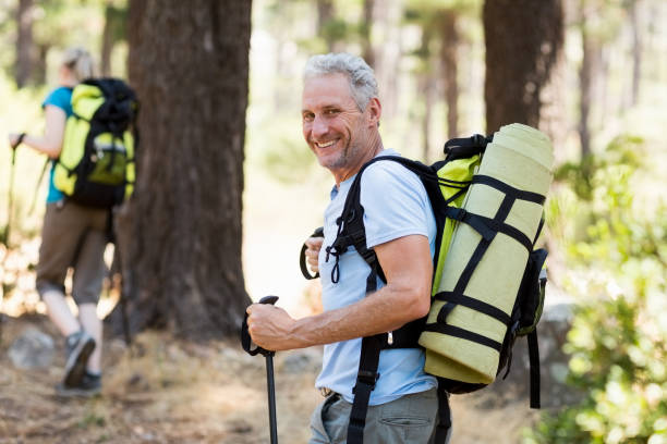 man smiling and hiking - backpack one mature man only only mature men one man only imagens e fotografias de stock