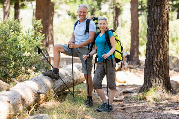 istock Couple smiling and posing during a hike 660703790