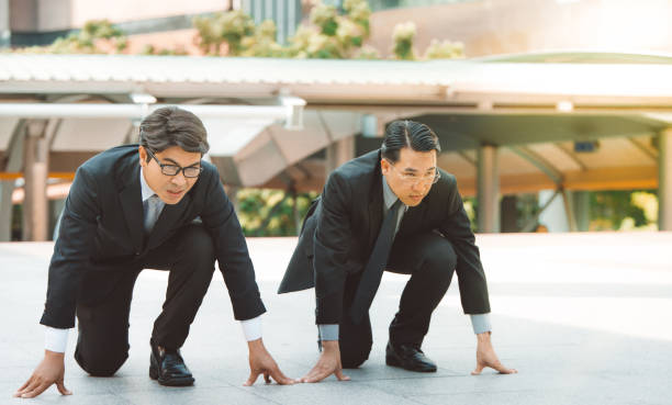 istock businessman getting ready for race competition business rival concept 660703832