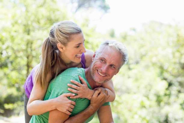 istock Couple smiling and holding each other 660707014