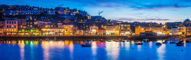 istock Fishing village harbour warmly illuminated at sunset St Ives Cornwall 660712414