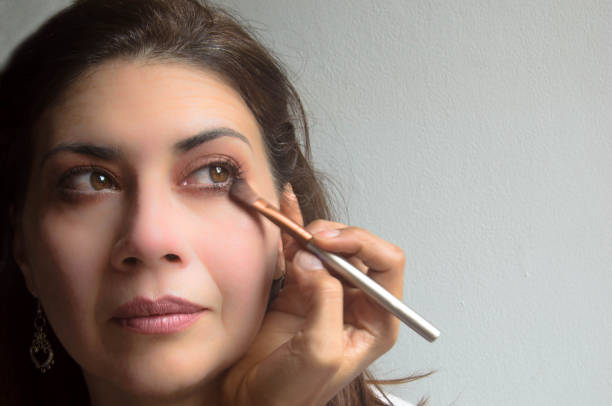 istock Close up of lady applying eyeshadow with a brush 660715962