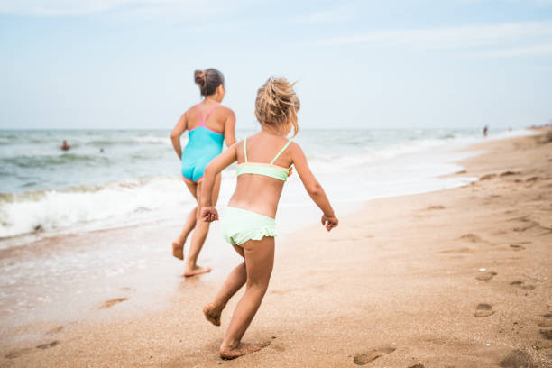 Kids having fun in water outdoors. 