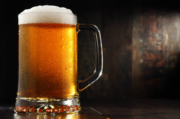 istock Composition with glass of beer on wooden background 660721976