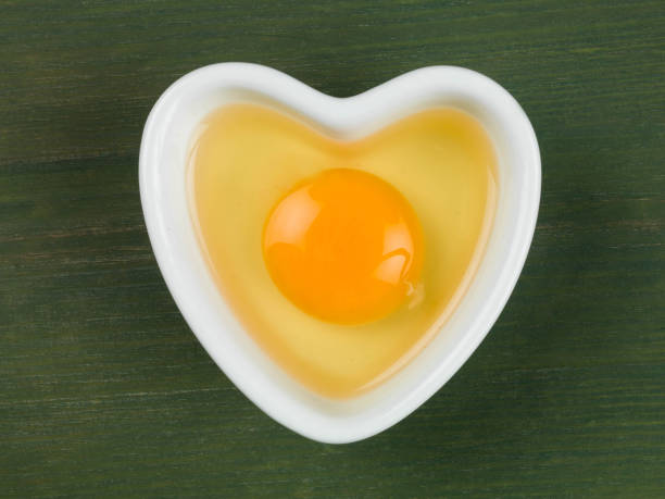 istock Raw Egg in a Heart Shaped Bowl or Dish 660728990