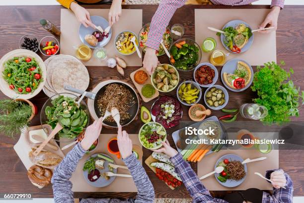 Friends Vegetarian Lunch Stock Photo - Download Image Now - Dining Table, Food, Cooking