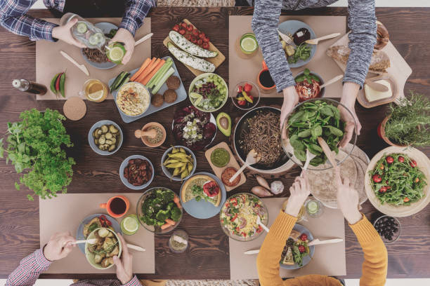 istock Group of people and food 660729914