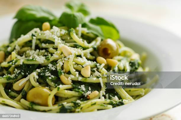 Tasty Beautiful Pasta Closeup With Spinach Cheese Olives Basil And Nuts Stock Photo - Download Image Now