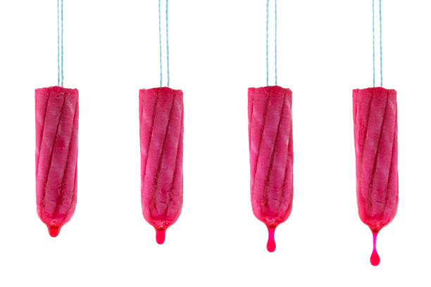 istock Tampon hanging with dripping red syrup liquid drop that looks like blood, isolated on white 660739348