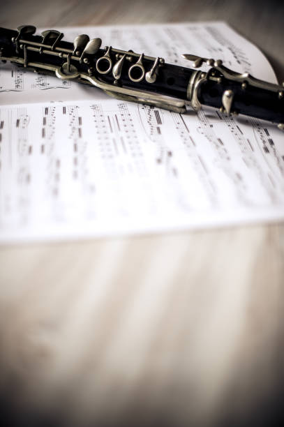istock Close Up Clarinet With Musical Note On Wooden Background 660739652