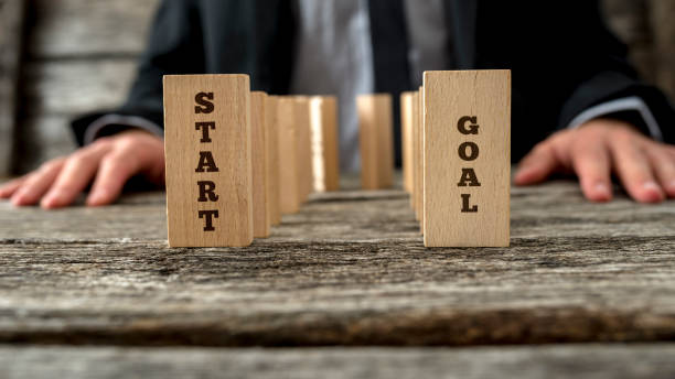 istock Dominoes with text start and goal 660747980