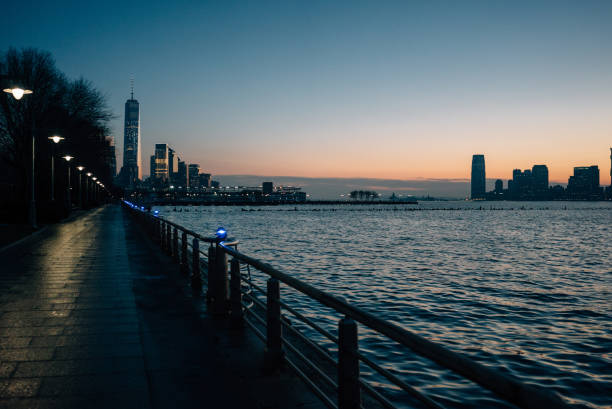 Waterfront promenade and modern buildings at night