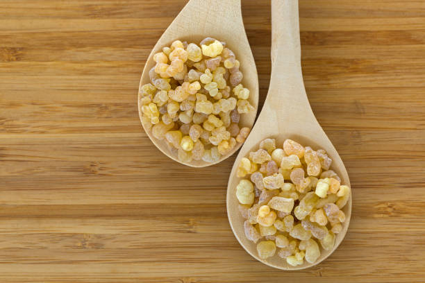 wooden spoon of aromatic yellow resin gum incense from sudanese frankincense tree - pyrolysis imagens e fotografias de stock