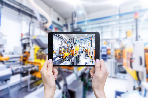 istock Digital tablet & futuristic industrial machinery 660751268