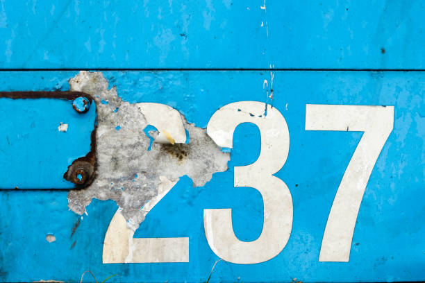 istock White figure on blue steel wall 660757902