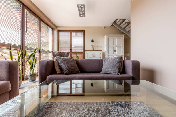 istock Elegant living room with glass coffee table 660764272