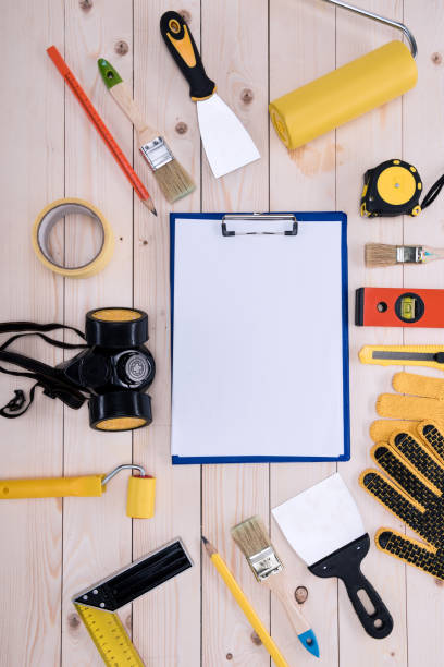 istock Top view of different tools with clipboard on wooden tabletop 660764998