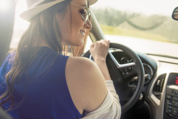 istock Happy young woman on road trip 660768922