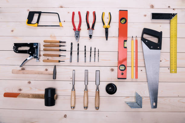 istock Top view of set of construction tools on wooden table 660772362