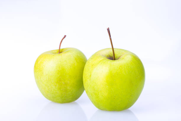 istock delicious juicy fresh green Apple on white background 660772568