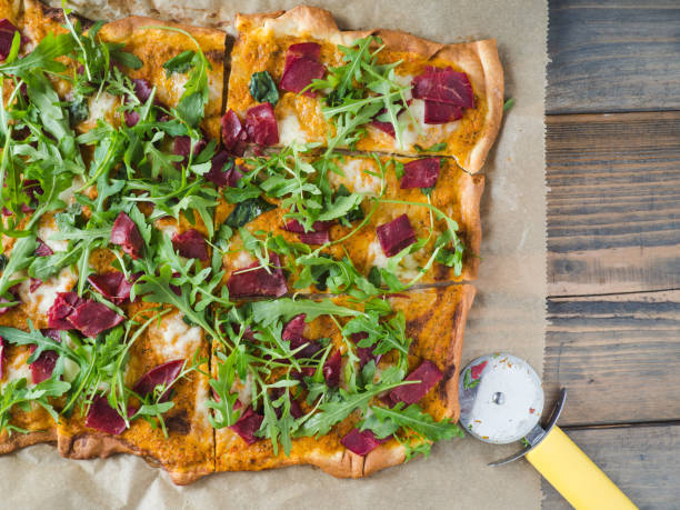 istock Tasty appetizing pizza with smoked meat and arugula 660783806