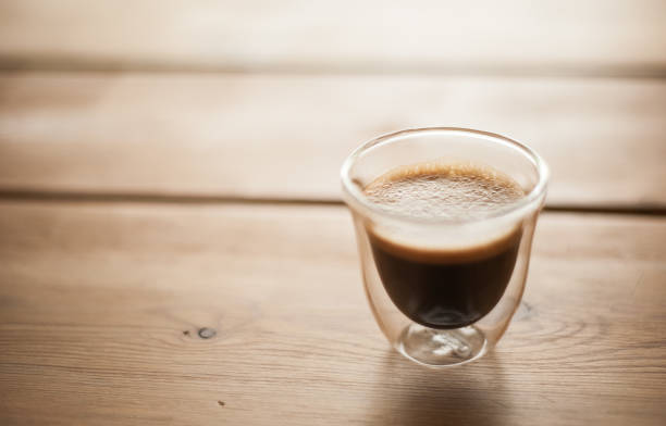 istock A clear cup of espresso on a wood table. 660784720