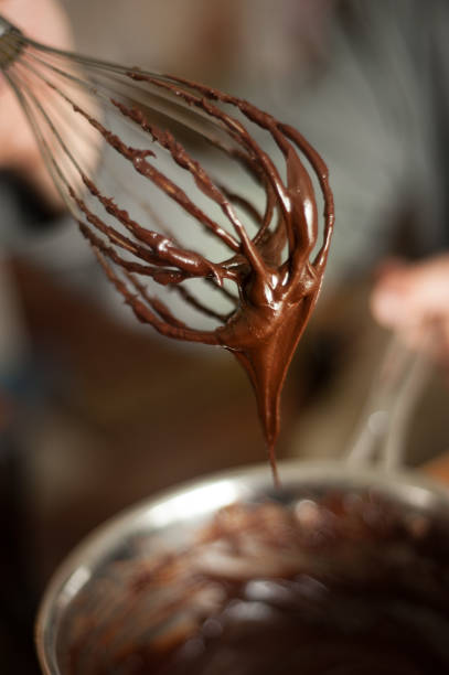istock Pan of chocolate ganache with a whisk. 660784894
