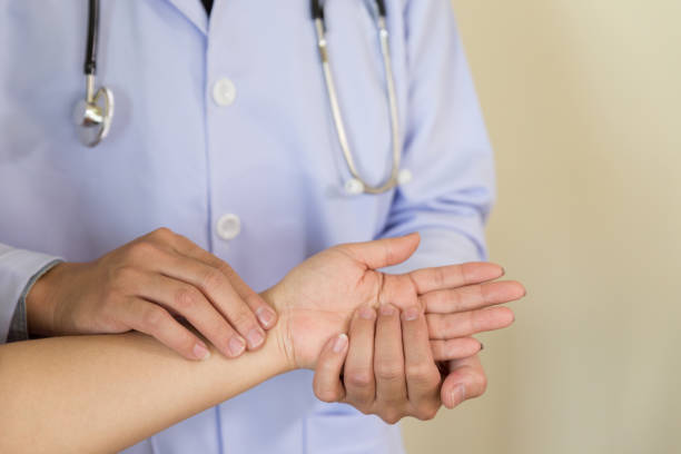 istock Doctor hands feeling pulse on female wrist 660787546