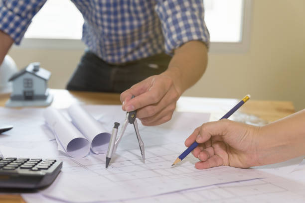 istock Architect or engineer meeting, working with blueprints and compass in office, Construction concept. 660792150