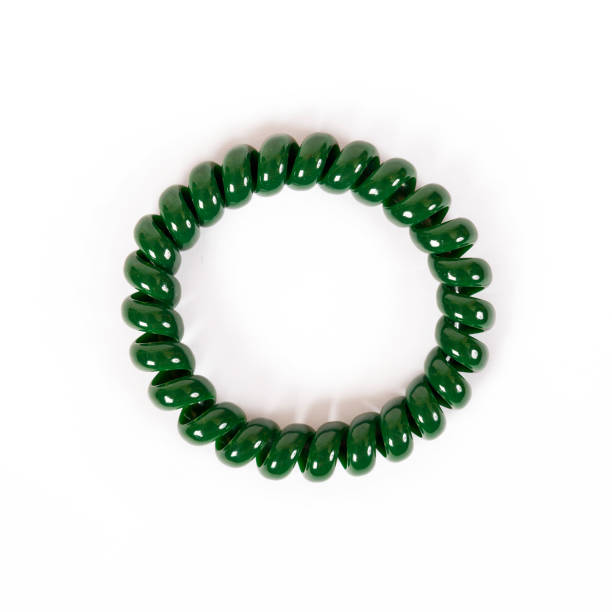 istock Round green spiral elastic band for hair 660792446