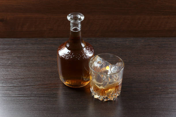 istock Glass whiskey on wood 660805318
