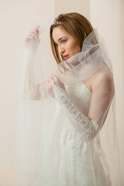 istock Beautiful young woman in wedding dressing 660805546