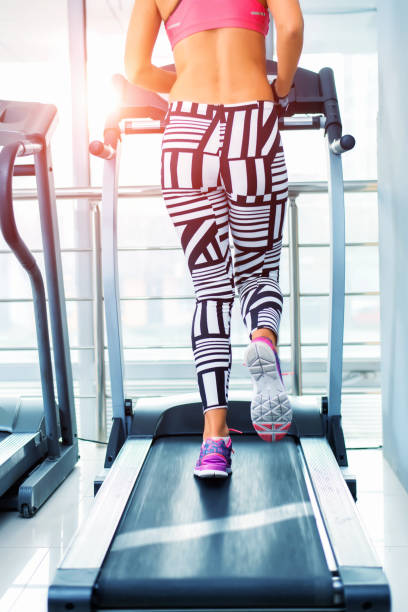 istock Unrecognizable woman running on treadmill 660819344