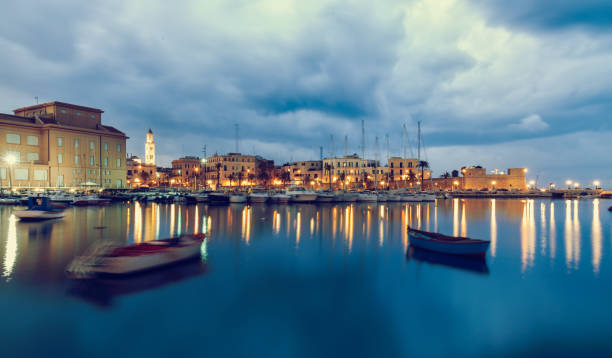 Bari seafront city view from marina. Blue sea and cloudy sky. Long exposure Filtered image Bari seafront city view from marina. Blue sea and cloudy sky. Long exposure bari photos stock pictures, royalty-free photos & images