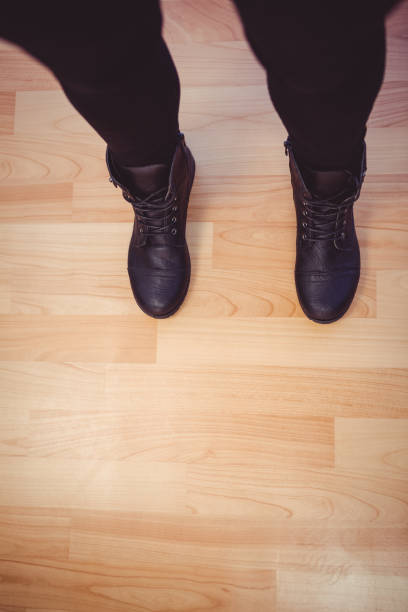 istock Cropped image of woman wearing boots 660844030
