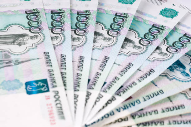 istock A stack of thousand-ruble banknotes, spread out money. Russian currency on a white background. 660884730