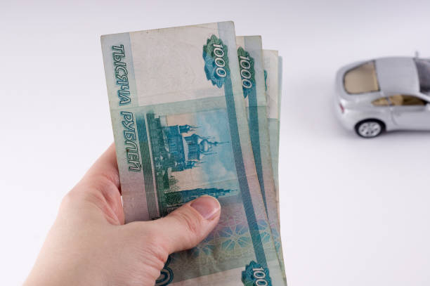 istock A stack of thousand-ruble banknotes, spread out money. Russian currency on a white background. 660884834