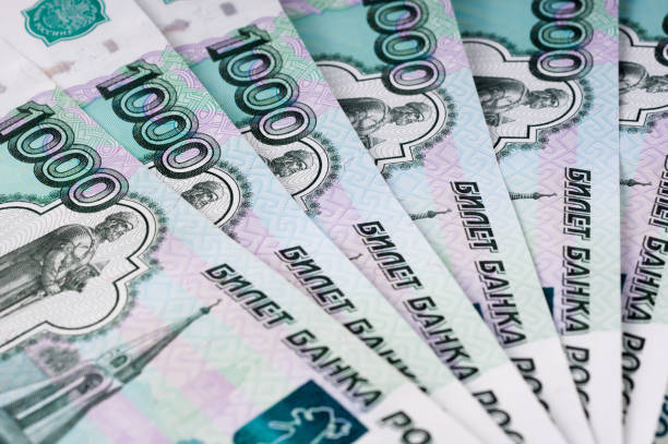 istock A stack of thousand-ruble banknotes, spread out money. Russian currency on a white background. 660884844