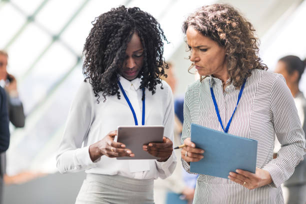 istock Businesswomen attending a conference 660890456