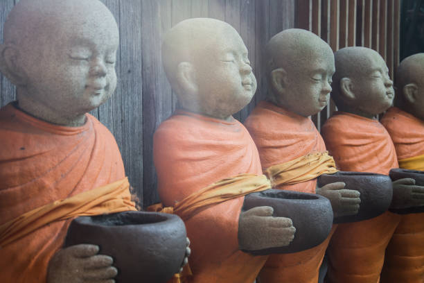 The statue of the monk looks calm.