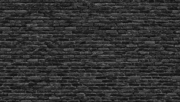 istock Dark brick wall, texture of a black brick background 660891960