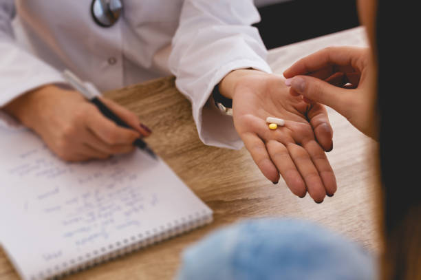 istock Doctor giving medicine to patient 660892590