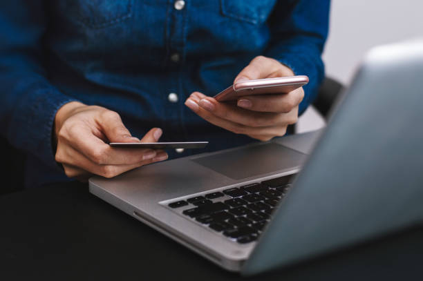 istock Hands holding credit card and using laptop. Online shopping 660892664