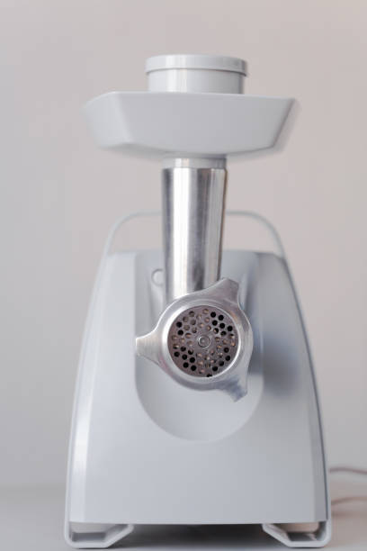 istock electric meat grinder is on the table. 660907680